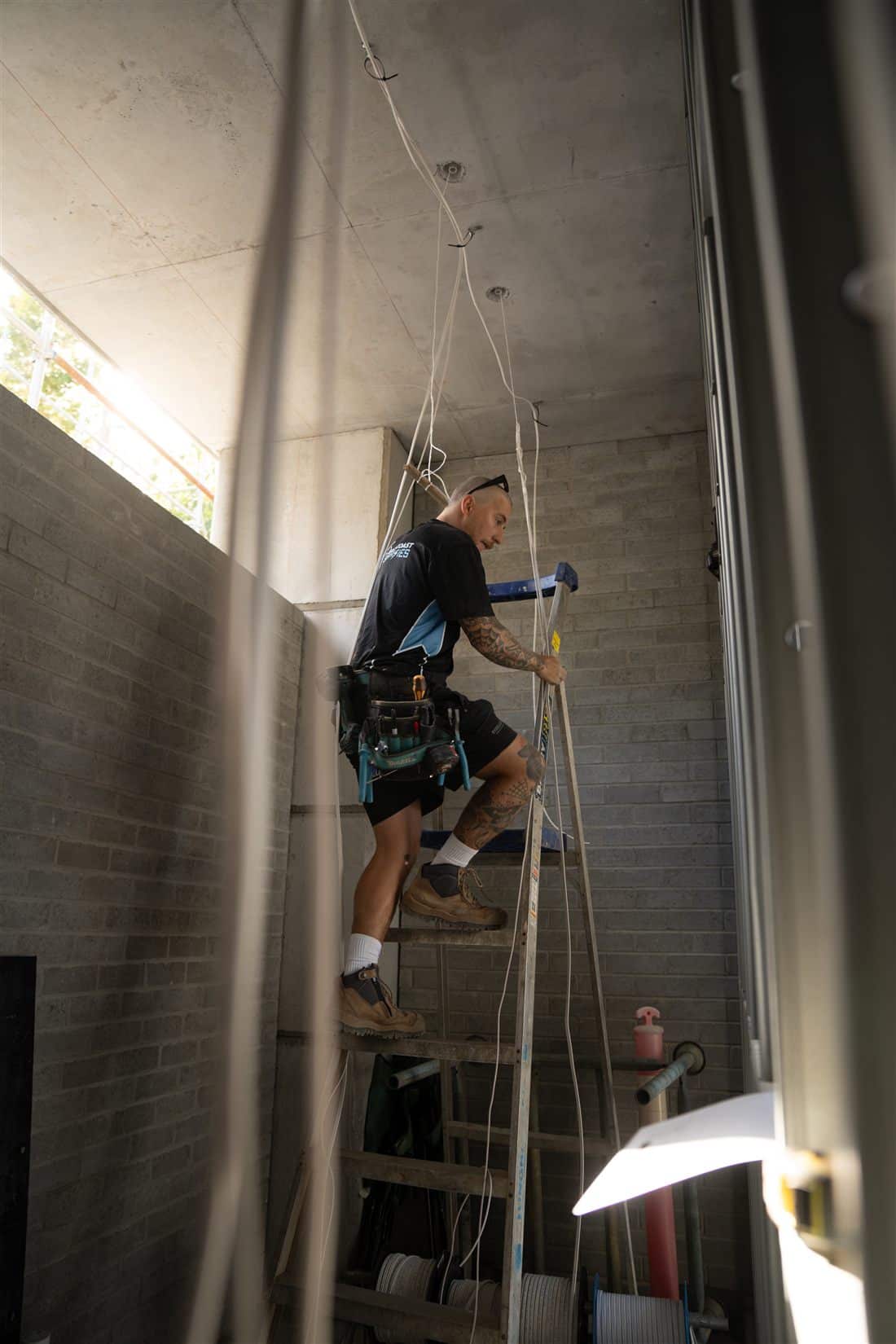 East Coast Sparkies electrician running cabling on a Gold Coast site